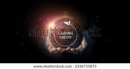 Carbon credit concept. Tradable certificate to drive industry and company in the direction of low emissions in efficiency cost. Green concept with carbon offsetting solution symbols. Royalty-Free Stock Photo #2336735873