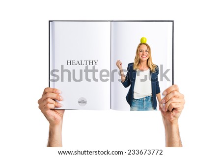 Blonde girl with apple above her head printed on book