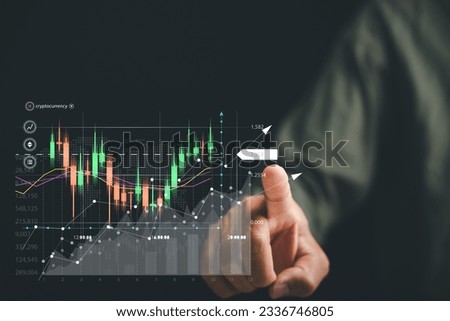 Trader's hand touches a growing virtual hologram stock on a screen, highlighting the opportunities for financial success through effective stock market investment planning.