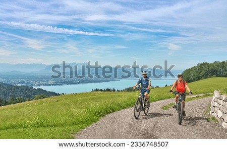 two senior girl friends having fun during a cycling tour above Lake Constance, Bregenz,Vorarlberg, Austria