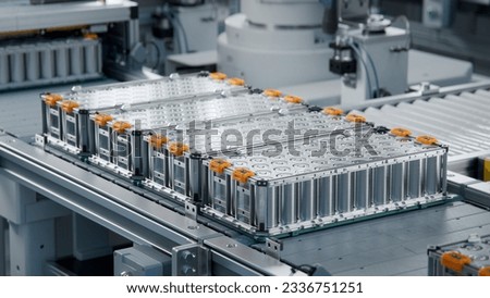 Lithium-ion High-voltage Battery Component for Electric Vehicle or Hybrid Car. Battery Module for Automotive Industry on Production Line. High Capacity Battery Production inside a Factory. Royalty-Free Stock Photo #2336751251