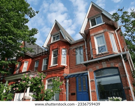 Old Victorian style narrow row houses with gables Royalty-Free Stock Photo #2336759439