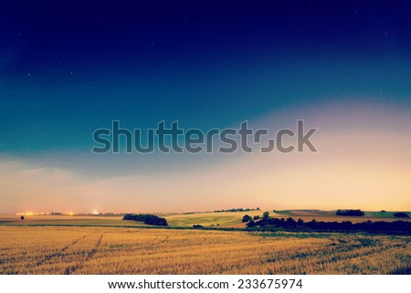 Starry night during summer in fields in country