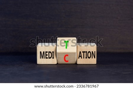 Meditation or medication symbol. Concept word Meditation medication on wooden block on a beautiful grey table grey background. Meditation or medication concept. Copy space.
