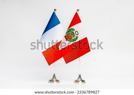 National flags of France and Peru on a light background. Flags.