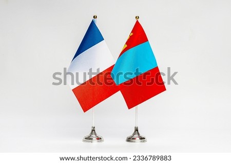National flags of France and Mongolia on a light background. Flags.