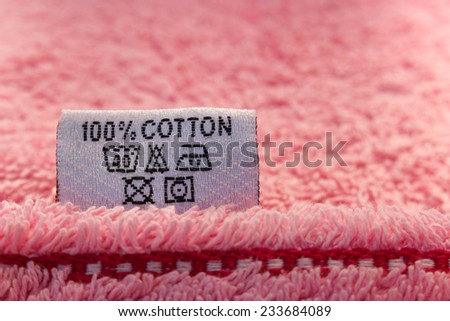 Label 100 % cotton on pink towel 
