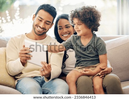 Father, mother and a child learning on a tablet in a family home with happiness, development and internet. Man, woman and son or kid together on home sofa with tech for education, games or online app