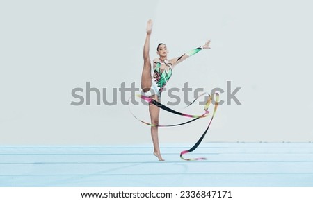 Gymnastics training, woman and ribbon with legs split for competition, sport and balance in portrait. Gymnast, athlete girl or professional dancer for concert, performance and contest with creativity
