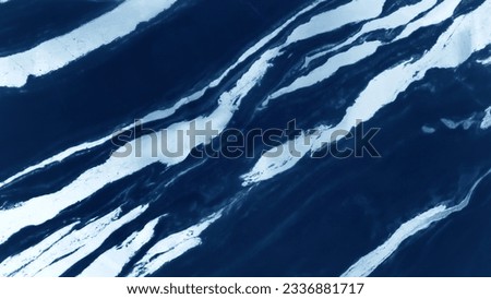 natural texture of navy blue marble with white veins pattern. Italian white and dark blue panda marble stone design. interior stone material for design.