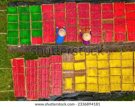 Top view of traditional village making colorful jelly food. They was drying fresh jelly on a wooden grid for the market. Lifestyle concept.