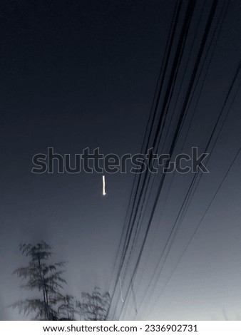 Blurring View In The Evening of Moon with Tree and Wire 