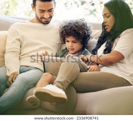 Mother, father and child learning on a tablet in a family home for development and internet. Man, woman and son or a kid together on a home sofa with technology for education, games and online app