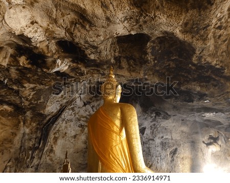 Buddha statue inside the cave  Kanchanaburi tourist attraction  Thailand takes pictures in the afternoon.