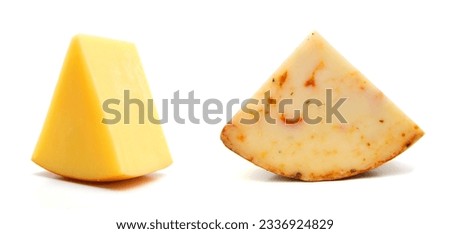 Cubes of cheddar cheese isolated on white  Royalty-Free Stock Photo #2336924829