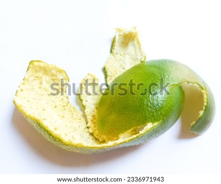 Fresh lime peel isolated on white background.