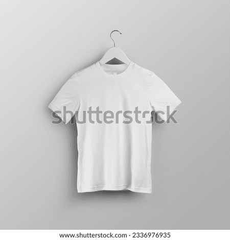 Children's white t-shirt template, blank shirt on hanger, front view, isolated on background. Mockup of stylish kids clothing for design, product photography for commerce, advertising