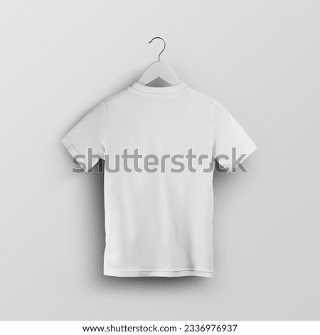 Mockup of a child's white t-shirt on a hanger, fashion clothes, back view, for design, print. Template of stylish kids shirt, isolated on the background. Product photography for commerce, advertising