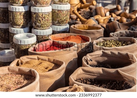 Bags of mixed spices and herbal tea in the street market. National cuisine and cooking concept. Bukhara, Uzbekistan Royalty-Free Stock Photo #2336992377