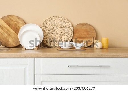 Kitchen counter with plate rack, clean dishes and cutting boards Royalty-Free Stock Photo #2337006279