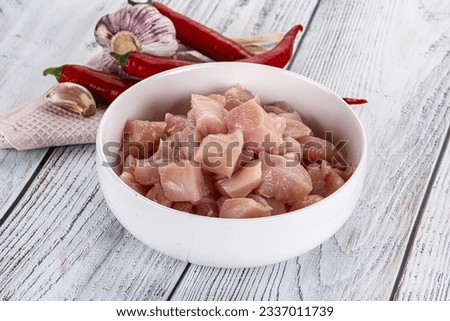 Raw uncooked chicken breast fillet in the bowl Royalty-Free Stock Photo #2337011739