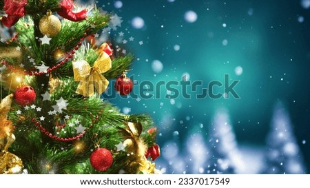 Decorated Christmas tree close-up against the backdrop of a winter forest with falling snow flakes. Beautiful background for Christmas and New Year.