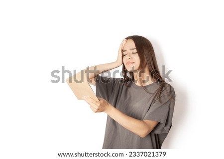 bad letter, bills and bank documents, credit payments, family news, a woman with an envelope in her hands holds her head on a white background Royalty-Free Stock Photo #2337021379