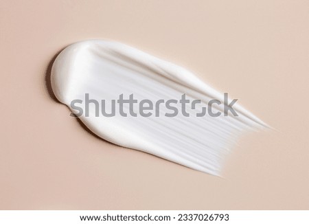 cosmetic smears of creamy texture on a beige background Royalty-Free Stock Photo #2337026793