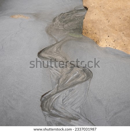 Sinusoid in sand; South Island, New Zealand Royalty-Free Stock Photo #2337031987