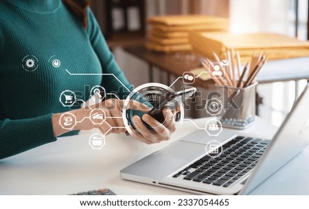 Businesswomen working with smart phone and laptop and digital tablet computer in office with digital marketing media in virtual icon.