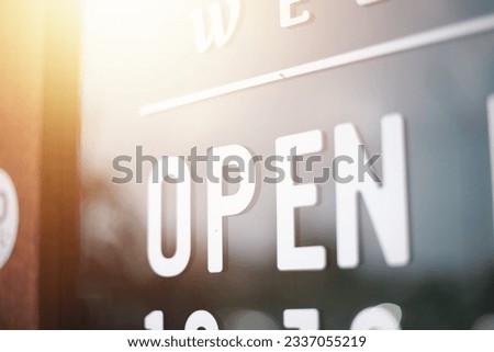 An open sign hangs at the entrance of the cafe due to the outbreak of the coronavirus (COVID-19). Many shops, businesses, shops and restaurants are now open after returning to normal.
