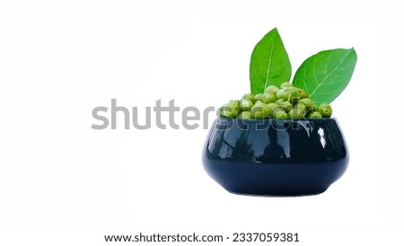 Henna or Lawsonia inermis tree leaves with green fruits in a ceramic bowl isolated white background, clipping paths