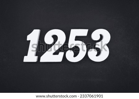 Black for the background. The number 1253 is made of white painted wood.