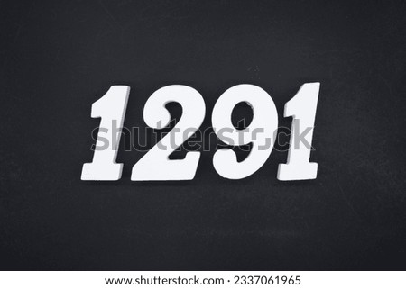 Black for the background. The number 1291 is made of white painted wood.