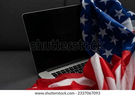 Internet and network security. Computer with binary computer code and American flag