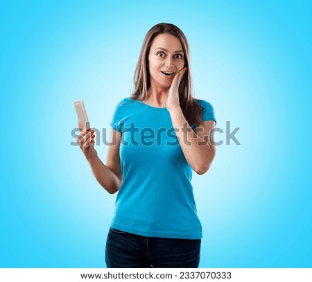 Young happy woman holding mobile phone
