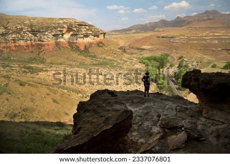 nature and hiking tourist wachting and enjoying the spatial impressive environment African landscape scenery 