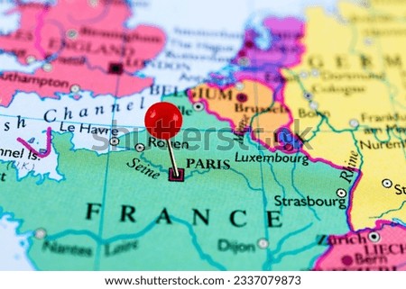 Paris map, France.  Close up of Paris map with red pin.