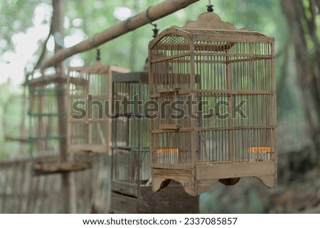 close up picture with blur background of an Old bird cage in market near Yogyakarta region