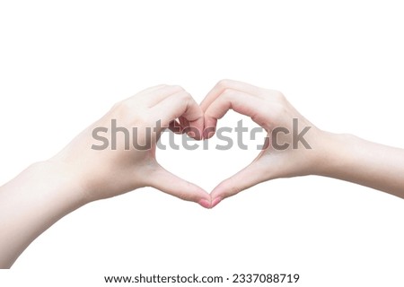 Beautiful female hand shows heart symbol as love sign in manicure concept.