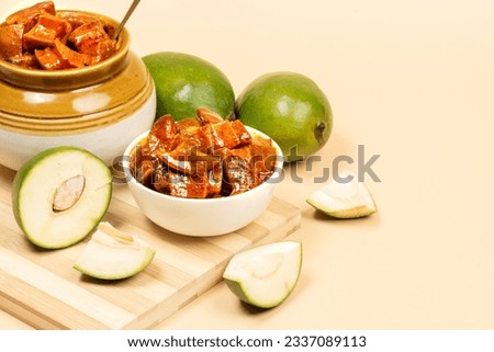 Andhra traditional home made raw mango sweet and spicy  pickle on a clean light brown  background- Selective focus
 Royalty-Free Stock Photo #2337089113