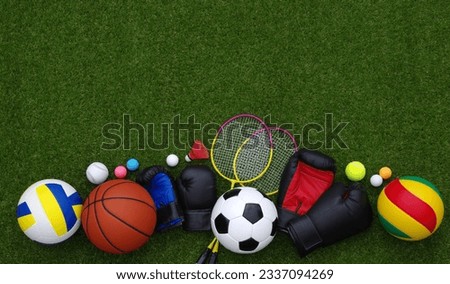 Set of sport equipment on green grass Royalty-Free Stock Photo #2337094269
