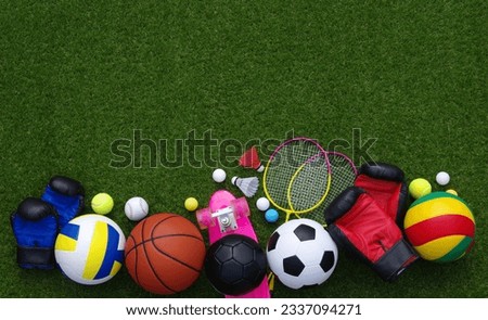 Set of sport equipment on green grass Royalty-Free Stock Photo #2337094271