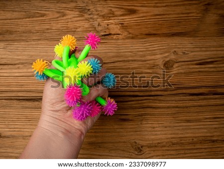Bright Colored Toy, Colorful Squeeze Antistress Toys, Soft Squishy Spider on Elastic Band, Color Plastic Puffer Balls, Fun Luminous Stressball, Rubber Monster Hedgehog Royalty-Free Stock Photo #2337098977