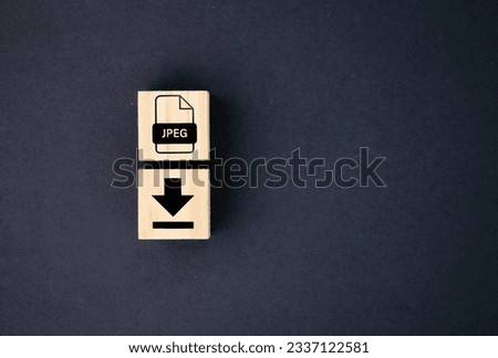 wooden cube with save jpeg file icon. the concept of storing files in cyberspace or in a computer. concept save jpeg format