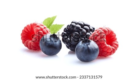 Mix berries in closeup with leaf on white background Royalty-Free Stock Photo #2337131579