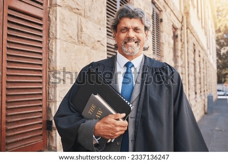 Portrait, judge or lawyer in city with legal books, constitution or research on policy, rules or knowledge on justice in court. Attorney, man with success or working with expert on government laws