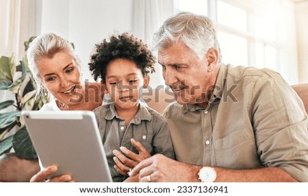 Family, grandparents and child on tablet in home e learning, online education and watch or streaming cartoon. Happy interracial kid and senior people on digital technology for teaching school on sofa