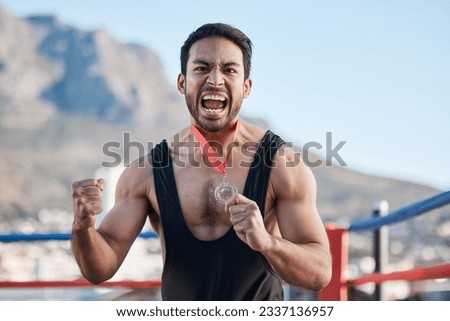 Champion man, wrestling medal and celebration in portrait, success or fist in air for sports contest on roof in Cape Town. Young athlete, games and winner for goal, achievement and fight competition