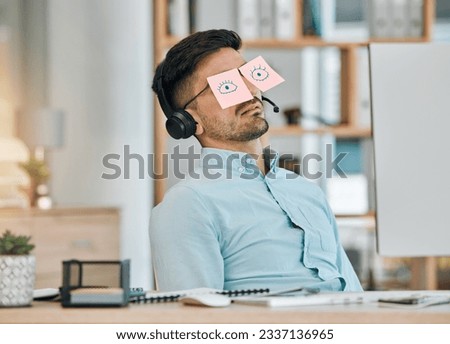 Tired, sleeping and business man with sticky note eyes from low energy and burnout at office desk. Fatigue, nap and rest of a male professional with drawing on glasses to pretend at a company Royalty-Free Stock Photo #2337136965